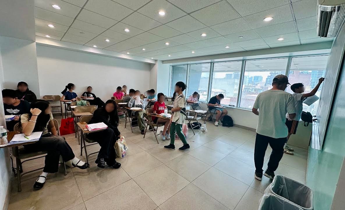 Spacious, sunlit classroom with floor-to-ceiling windows overlooking downtown Flushing